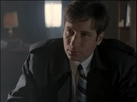 A young Fox Mulder talks with Arthur Dales