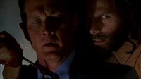 Doggett is taken hostage by the killer