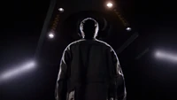 Mulder standing beneath a UFO.